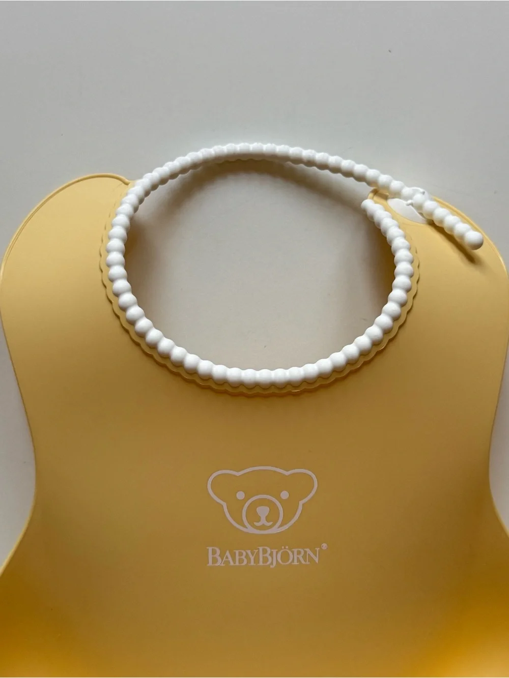 Set of 2 BabyBjorn Feeding Bibs - Blue & Yellow